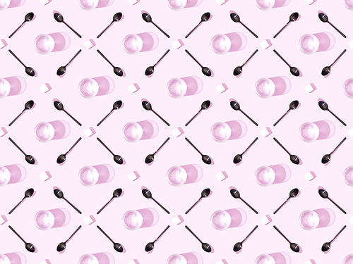 top view of lump sugar with black spoons and water on violet, seamless background pattern