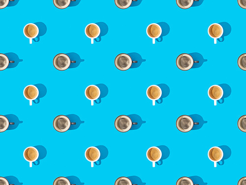 top view of cups of fresh coffee on blue, seamless background pattern