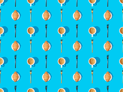 top view of cutlery, croissants on plates and coffee on blue, seamless background pattern