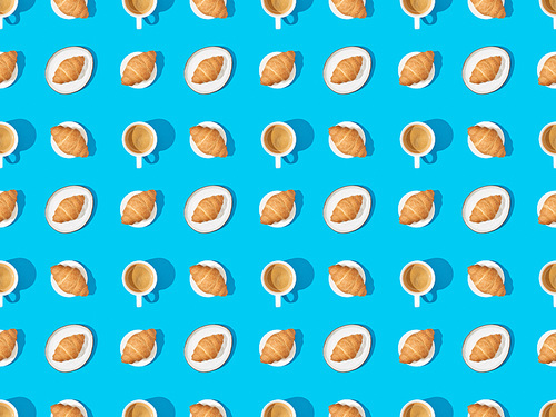 top view of croissants on plates and coffee on blue, seamless background pattern