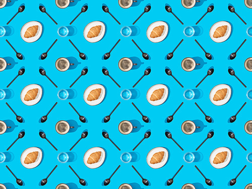 top view of spoons, croissants on plates, water and coffee on blue, seamless background pattern