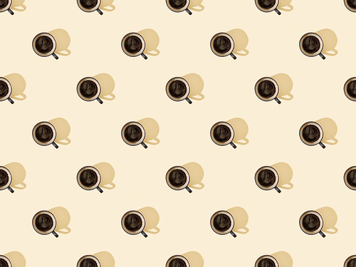 top view of cups of fresh coffee on beige, seamless background pattern