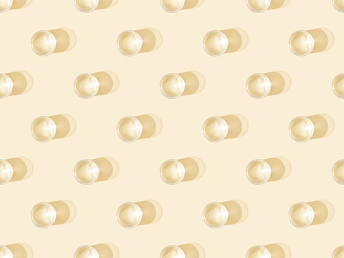 top view of glasses of water on beige, seamless background pattern