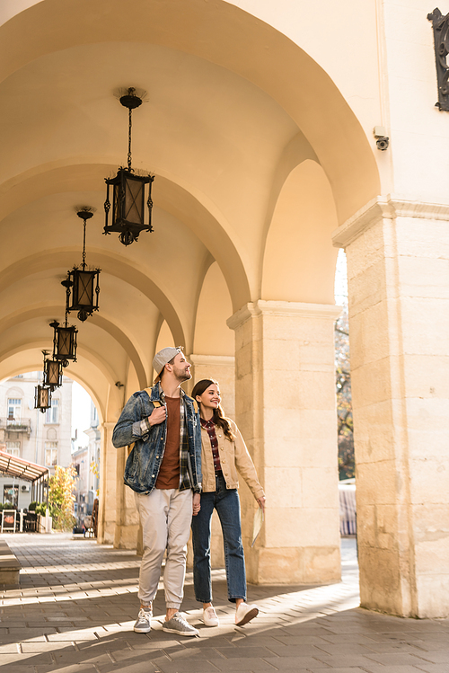 Boyfriend and girlfriend walking together in city