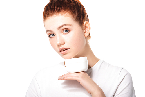 attractive female teenager with perfect skin holding plastic container with cosmetic cream, isolated on white