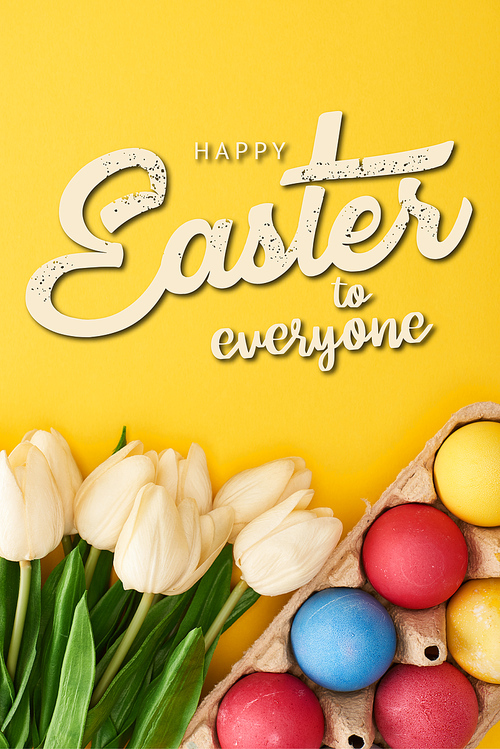 top view of tulips and multicolored painted Easter eggs in cardboard container on colorful yellow background with happy Easter to everyone illustration