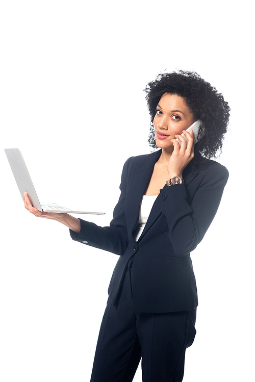 Successful african american businesswoman , holding laptop and talking on phone isolated on white