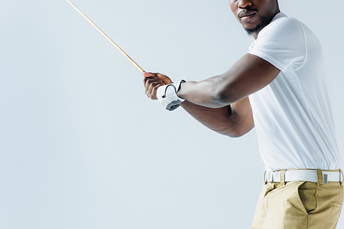 partial view of african american sportsman playing golf isolated on grey