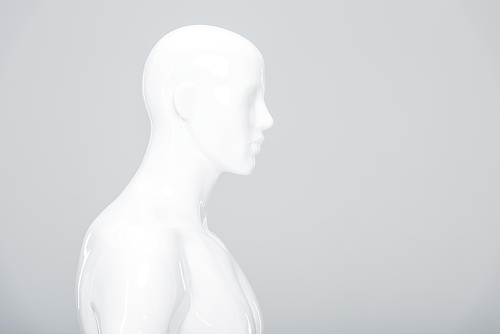 white plastic mannequin isolated on grey with copy space