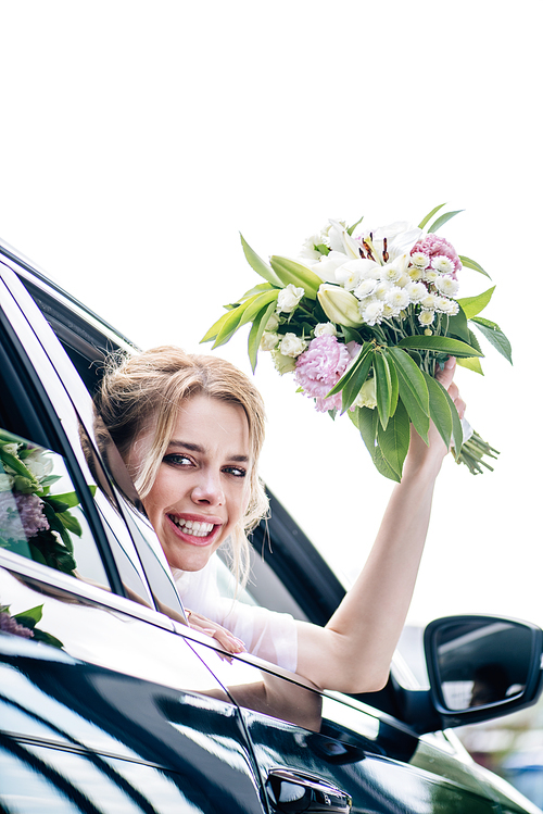 attractive and blonde bride holding bouquet and 