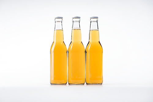 three bottles of beer on white background