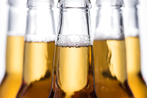 selective focus of beer bottles with bubbles