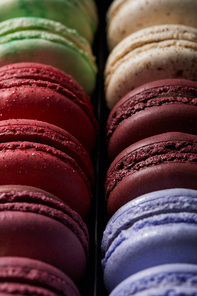close up view of assorted delicious colorful french macaroons