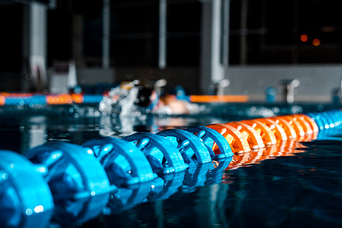 selective focus of buoys in water near swimmer