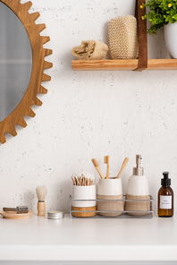 Bathroom with eco friendly objects and cosmetic products on shelves, zero waste concept