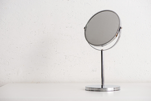 Round mirror on white background, zero waste concept