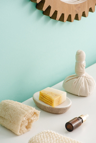 Selective focus of loofah, bottle of cosmetic oil, soap and thai herbal compress ball in bathroom, zero waste concept