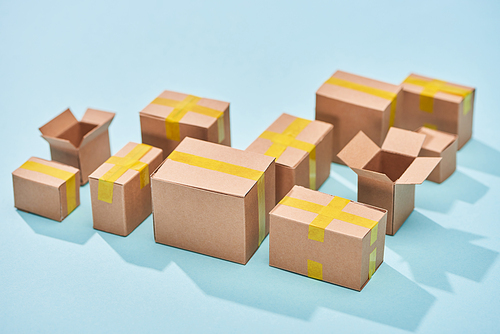 cardboard boxes on blue background with copy space