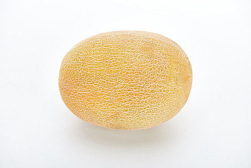 whole ripe yellow melon on white background