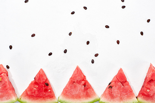 row of delicious juicy watermelon slices on white background