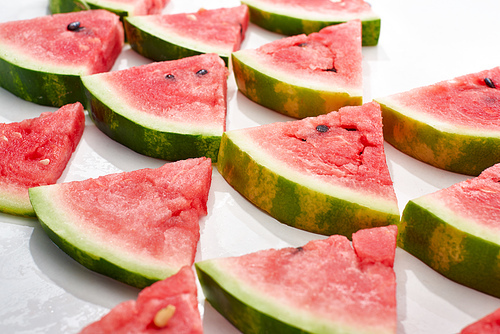 flat lay with delicious juicy watermelon slices on white background