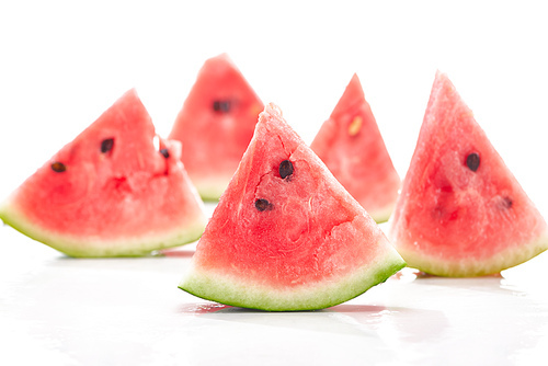 selective focus of delicious juicy watermelon slices on white background