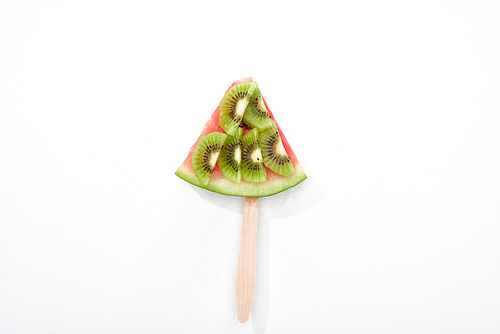 top view of delicious watermelon on stick with kiwi on white background