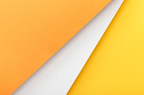 Top view of yellow, orange and white background