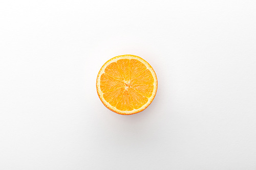 Top view of orange half on white background