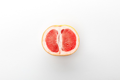 Top view of grapefruit half on white background