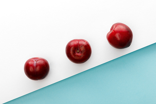 Top view of apples on white and blue background