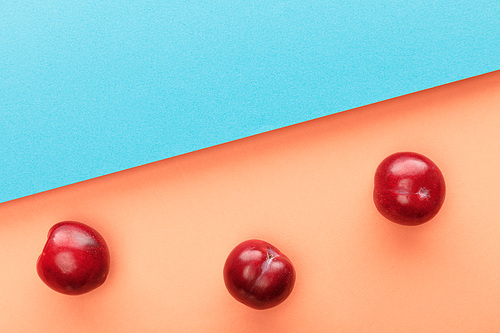 Top view of apples on blue and orange background