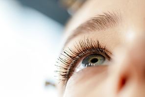 low angle view of woman with mascara on eyelashes