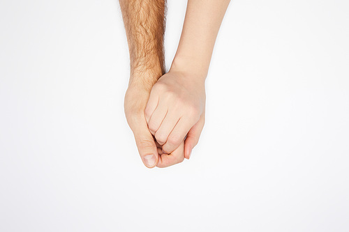 top view of couple holding hands isolated on white