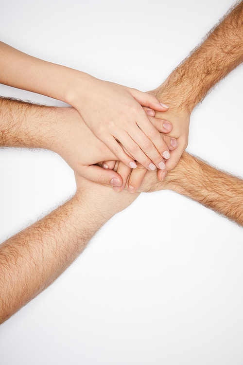 top view of men and woman holding hands isolated on white