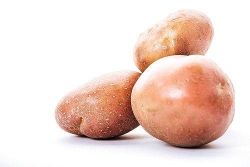 organic raw potatoes on white background