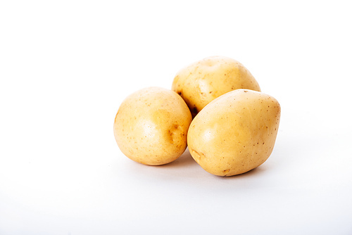 organic raw potatoes on white background