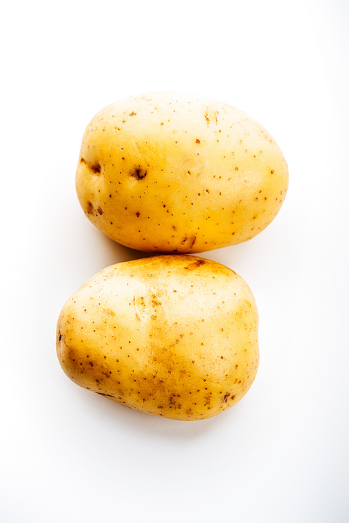 top view of raw whole fresh potatoes on white background