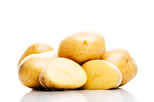 raw whole and cut fresh potatoes isolated on white