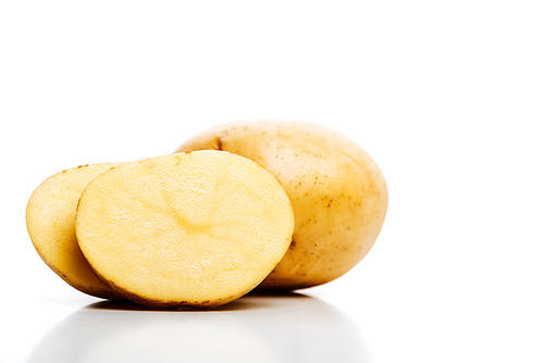 raw whole and cut fresh potatoes isolated on white