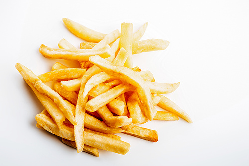 heap of fresh golden french fries on white background