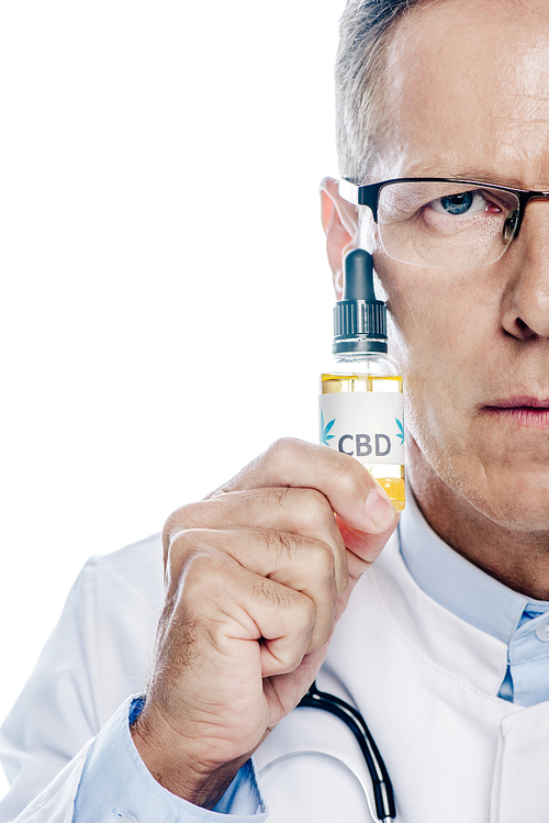 cropped view of doctor in white coat holding cbd isolated on white