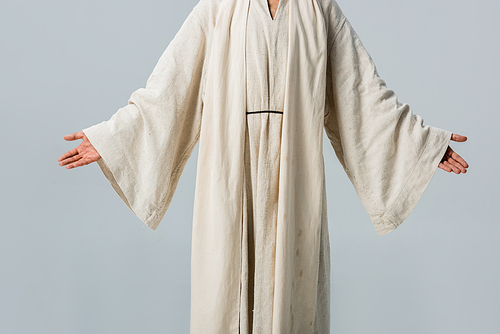 cropped view of man in jesus robe with outstretched hands isolated on grey