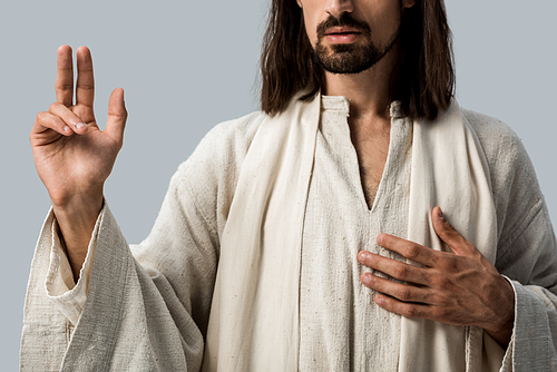 cropped view of bearded man with hand on chest isolated on grey