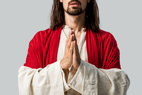 cropped view of man praying isolated on grey