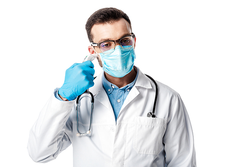doctor in medical mask and white coat using pyrometer isolated on white