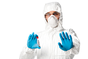 man in hazmat suit holding test tube with coronavirus blood sample lettering and showing stop sign isolated on white