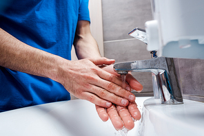 cropped view of doctor washing hands in clinic