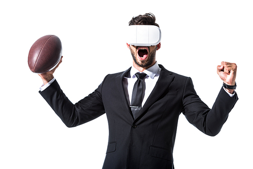 cheering businessman in virtual reality headset with rugby ball and clenched hand Isolated On White