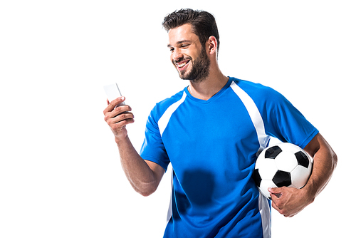 smiling soccer player with ball using smartphone Isolated On White
